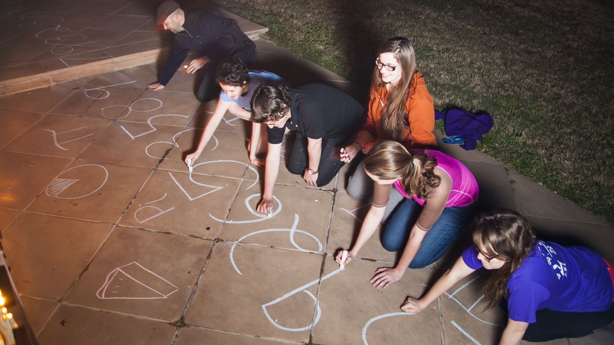 ԰ Math Students draw the numerals of Pi on a campus sidewalk