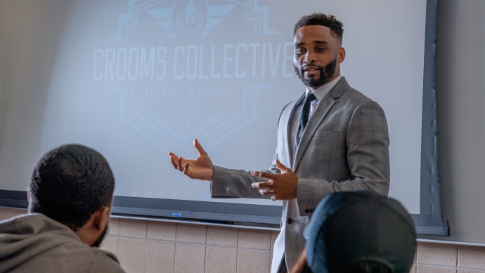 Brandon Crooms lectures to an audience